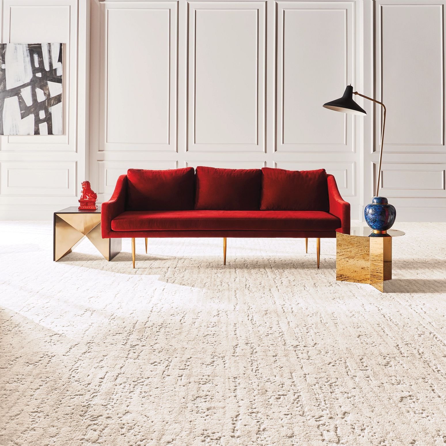 a red sofa on a beige soft carpet floor from Sams Floor Covering in Winchester, KY