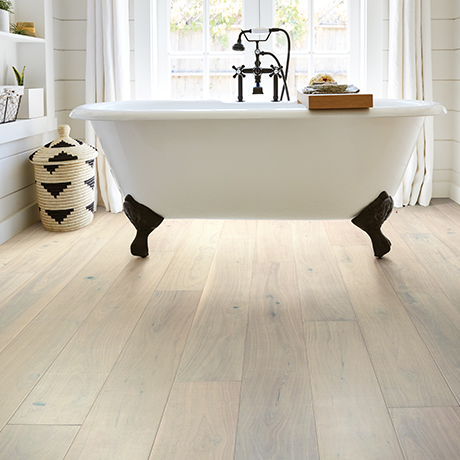 A white bathtub on the waterproof hardwood provided by Sams Floor Covering in Winchester, KY